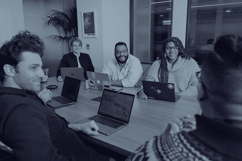 researchers and community members meeting in conference room