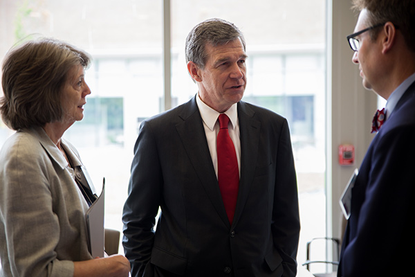 Governor Roy Cooper talks with panelists