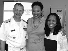 Acting Surgeon General Boris D. Lushniak, MD, MPH, RADM, meets with Monique Bethell, PhD, a volunteer at Healing with CAARE, Inc., and Health Equity Coordinator, Community Transformation Grant for the North Carolina Division of Public Health, Department of Health and Human Services (center); and Dr. Sharon Elliott-Bynum, Founder of Healing with CAARE, Inc. (right).